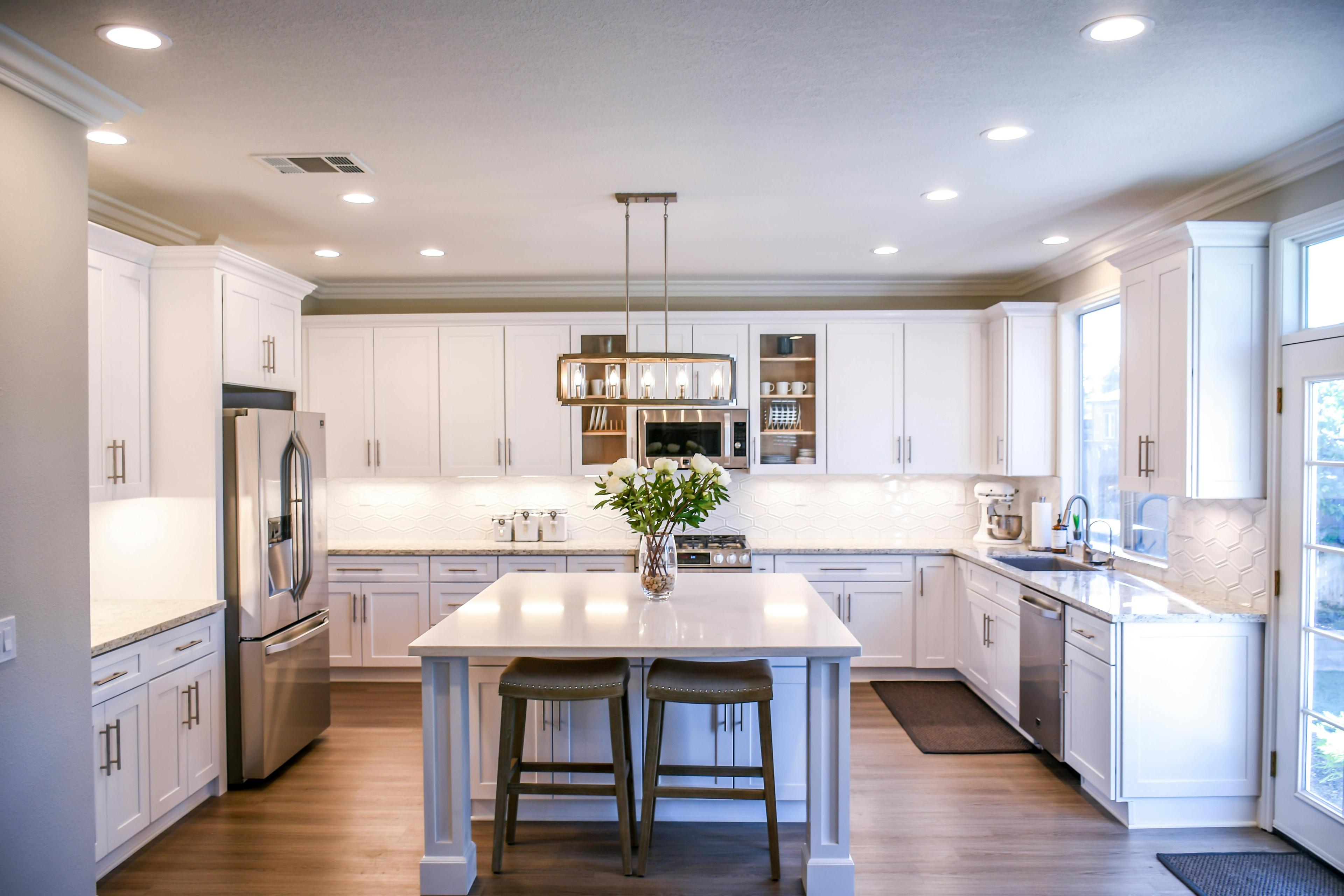 Modern modular kitchen with warm wood finishes, DLF Phase 4 Gurugram